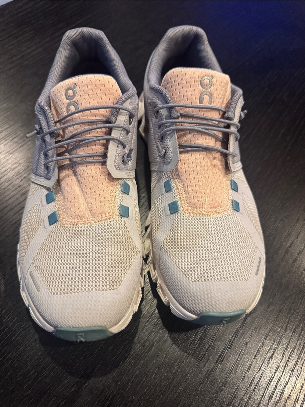 On Cloud Sneakers in Peach and Grays, Teal Accents. Elastic cord laces. Size 8.5